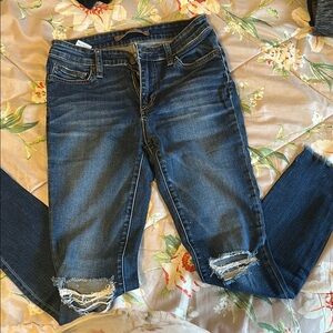 Women's Distressed Blue Jeans